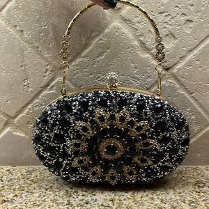 Glamorous structured evening bag. Top handle. Also 45 inch long chain. Brand new